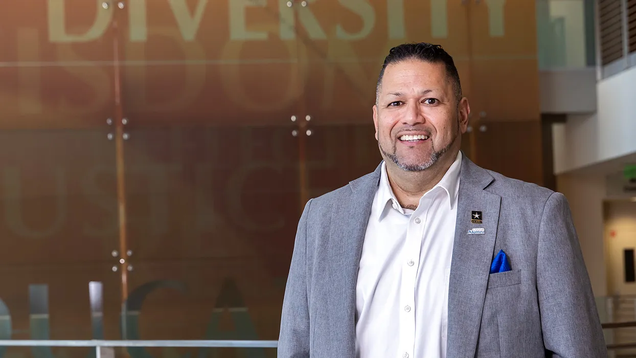 CSUSB alumnus RalphFigueroa, a rehabilitation counseling graduate, U.S. Army veteran and first-generation college graduate, on the Cal State San Bernardino campus.