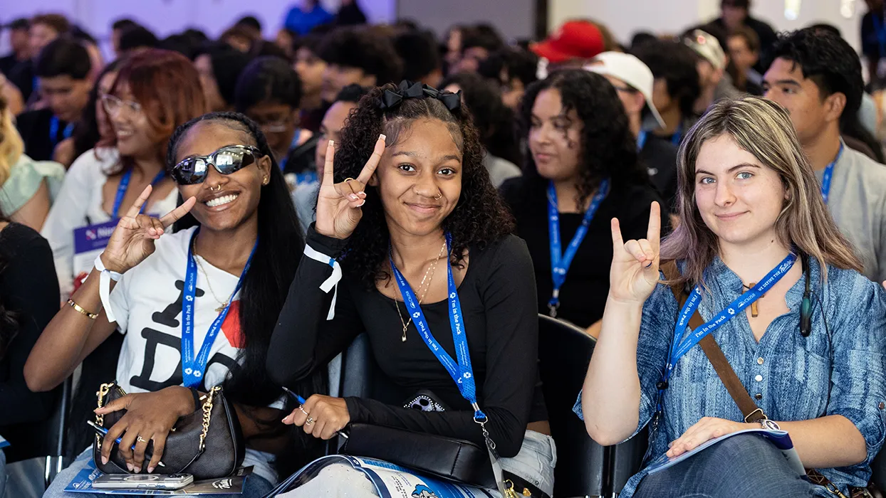 Three CSUSB students show Coyote spirit.
