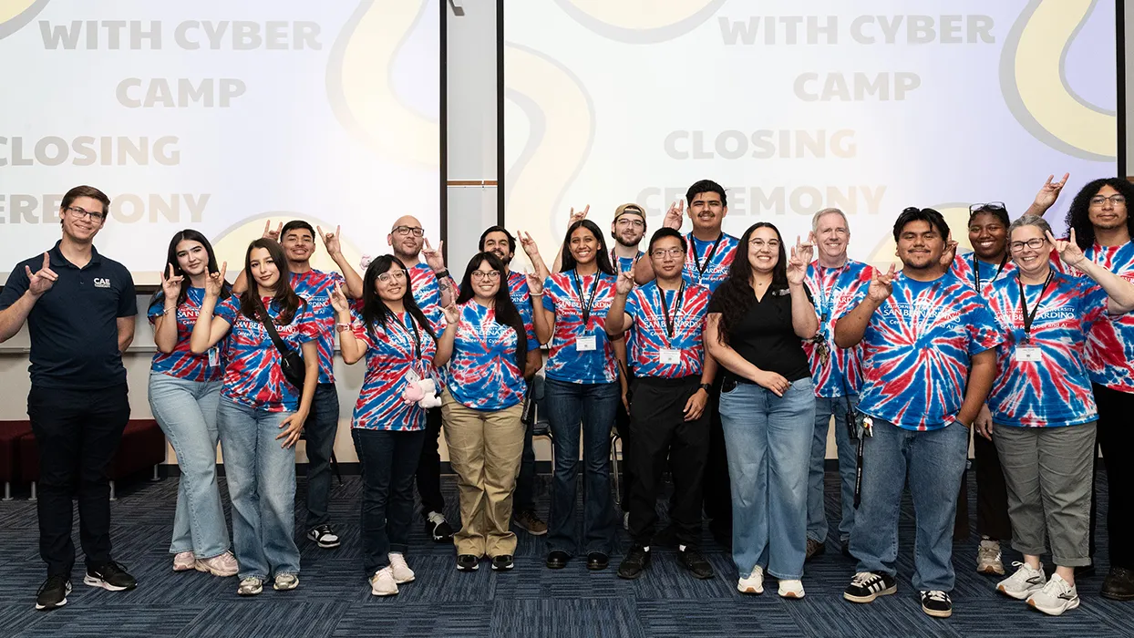 Faculty, CSUSB students and WITH Cyber campers show off their Coyote spirit.