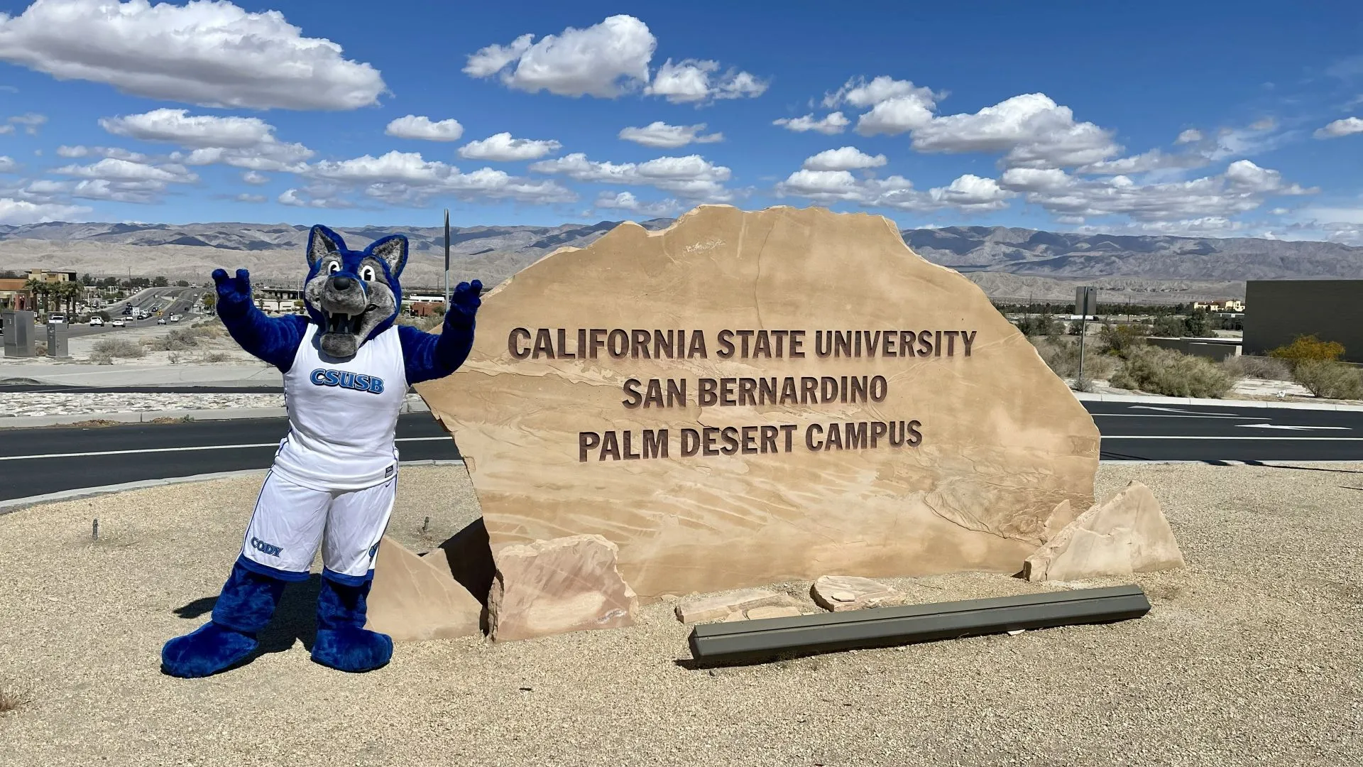 Cody the Coyote stands at the entrance of the CSUSB Palm Desert Campus.