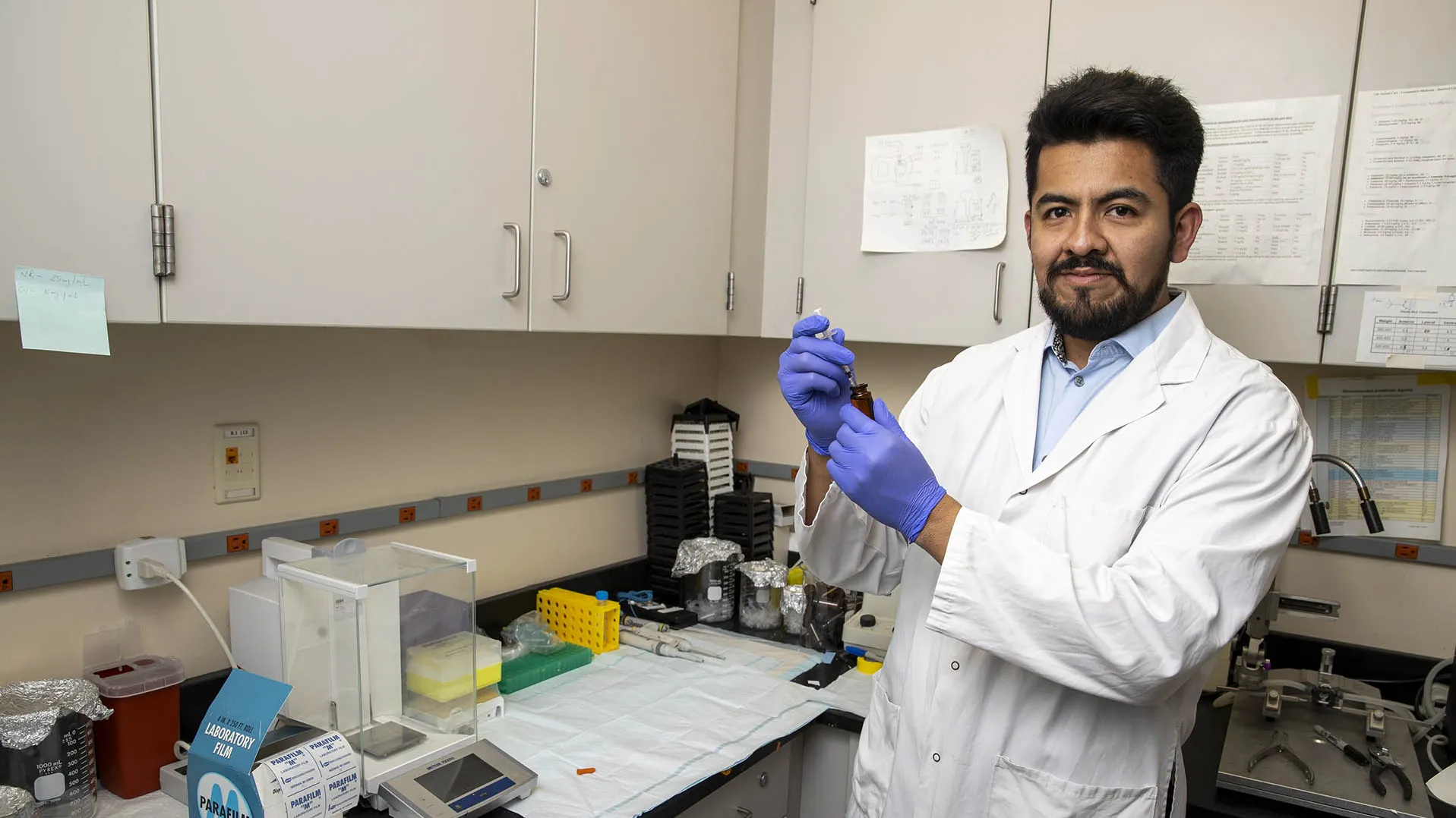 Graduate student Luis Gonzalez in a psychology lab at CSUSB
