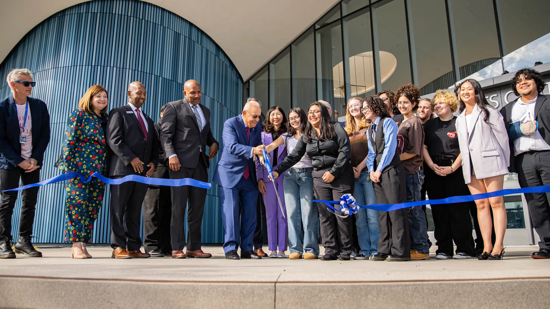 Students, faculty and administrators cut the symbolic ribbon marking the official opening of Cal State San Bernardino’s new Performing Arts Center.
