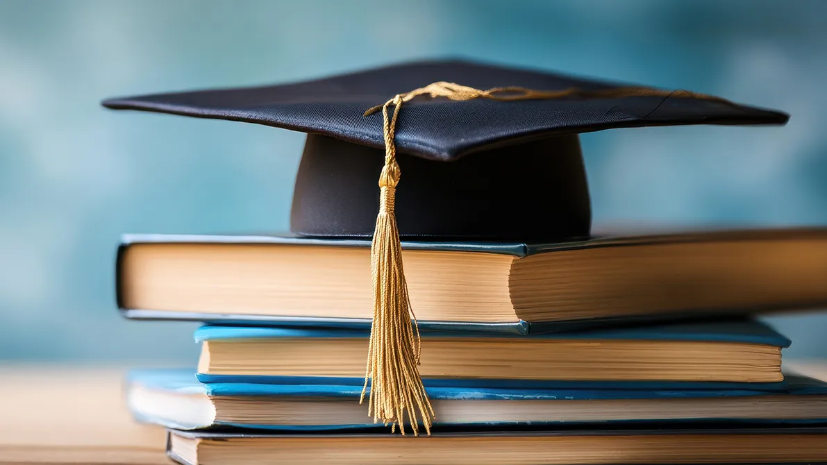 Illustration of a mortar board and books symbolizing academics.