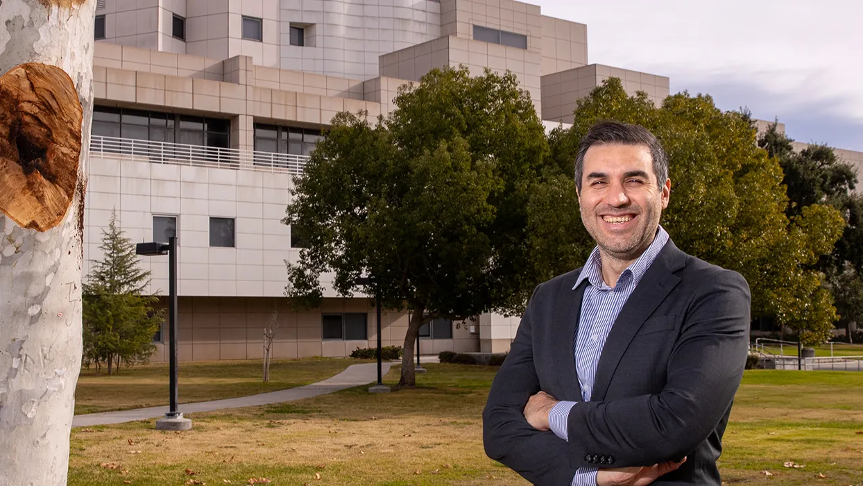 CSUSB graduate student and entrepreneur, Naja Faysal, in front of Jack H. Brown College of Business and Public Administration