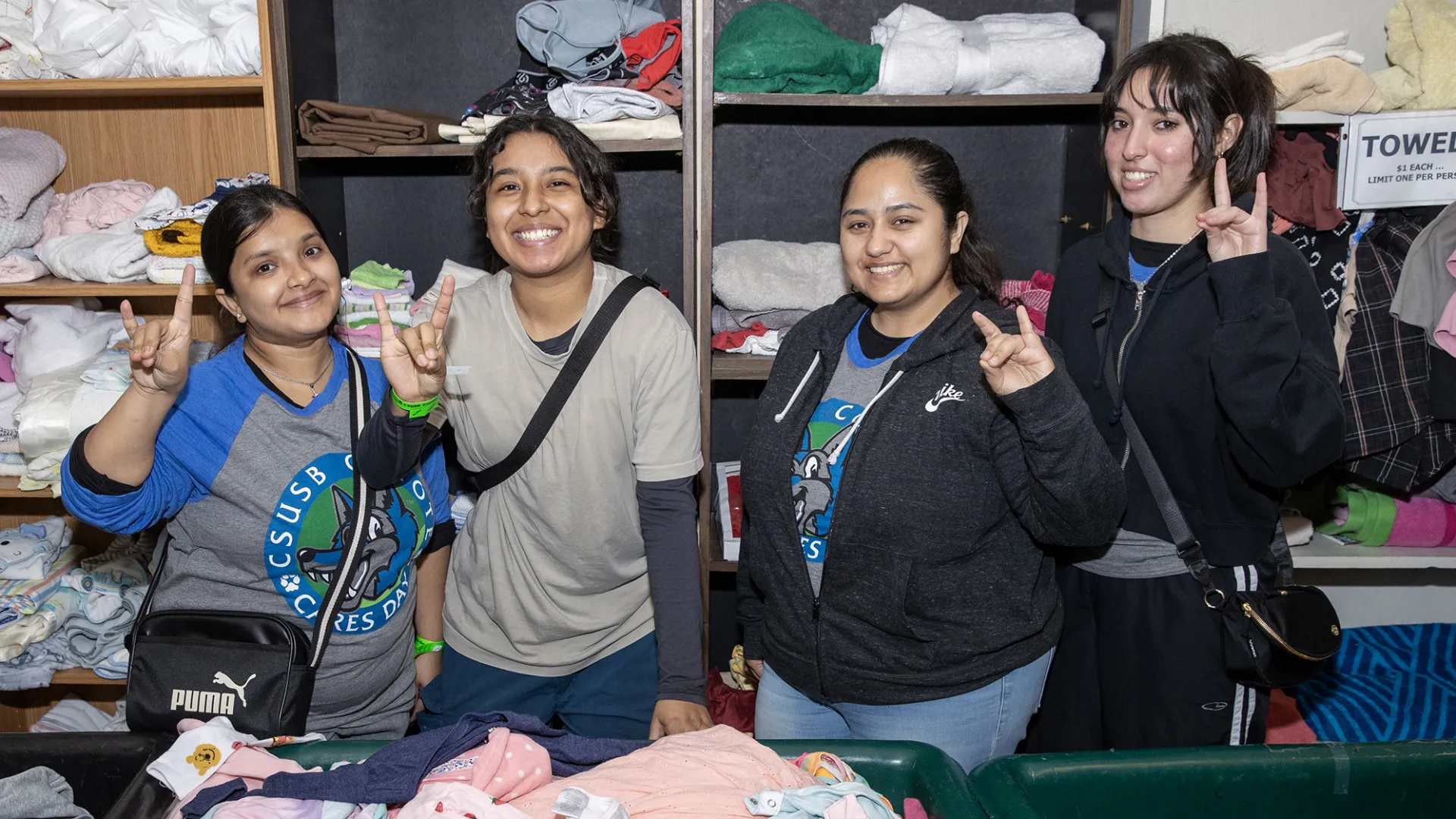 Four students during Coyote Cares Day 2024.