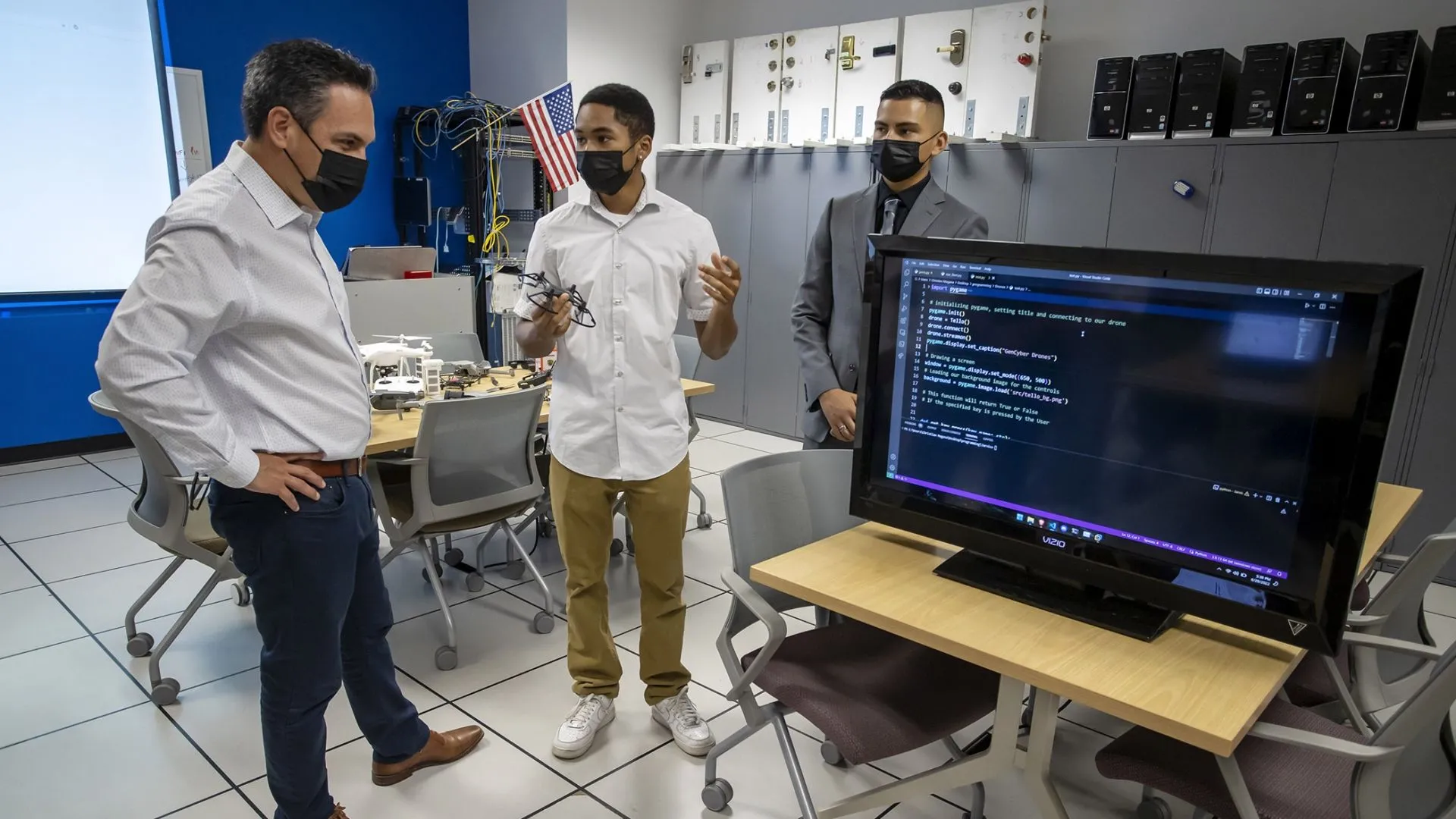 U.S. Rep. Pete Aguilar (left) and students at the CSUSB Cybersecurity Center during a visit on Aug. 29.
