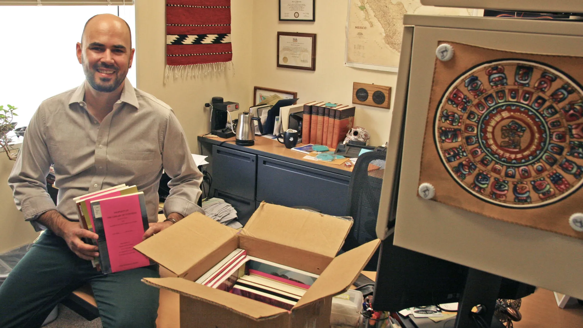 Professor showing books