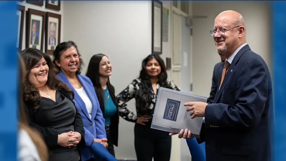 Tomás Gómez-Arias (at right), dean of CSUSB’s Jack H. Brown College of Business & Public Administration, meets with students enrolled in the university’s master’s in human resources program.