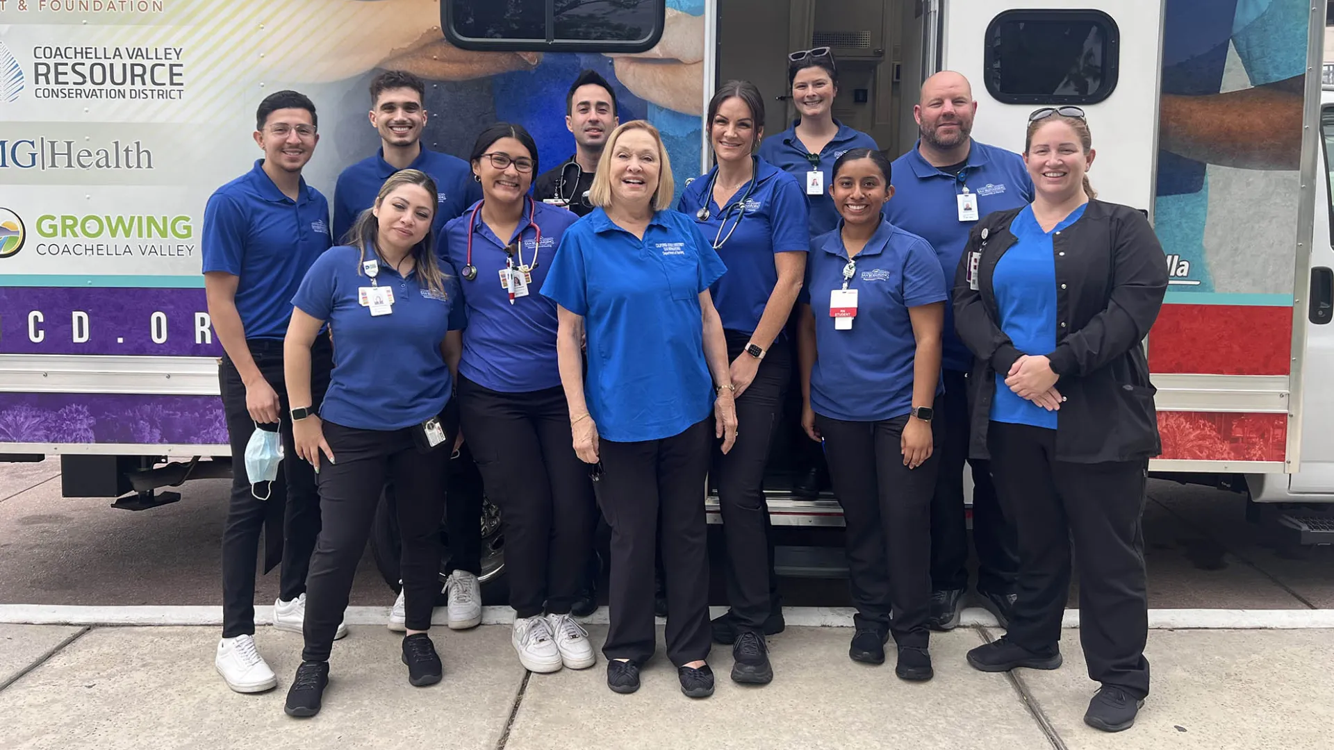 Members of the CSUSB Nursing Street Medicine Program pose in front of a new mobile medical clinic at the unveiling and ribbon-cutting ceremony in Palm Springs, Calif. on Dec. 2. From L to R: Danny Castaneda, Veronica Cretsinger, Sayaff Eid, Jessica Rodriguez, Alexis Molina Gonzalez, Diane Vines, Sarah Harrington, Julie Suriano, Nallely Herrera, Matthew Morse, Catherine Lievanos.