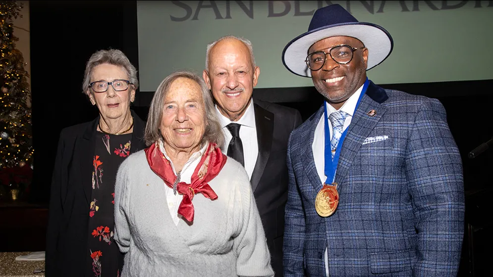 From left, Shelby Obershaw, Ingeborg Schuler, CSUSB President Tomás D. Morales, Terrance L. Stone.