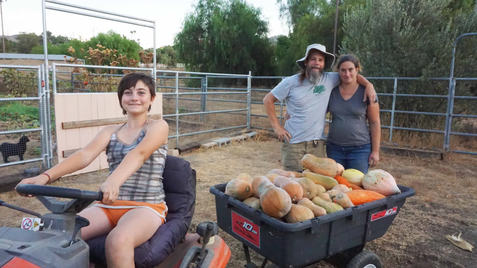 Becky Talyn (far right), a lecturer of biology, and Erik Melchiorre (center), a professor of geology, and their daughter, Gabrieila (seated)