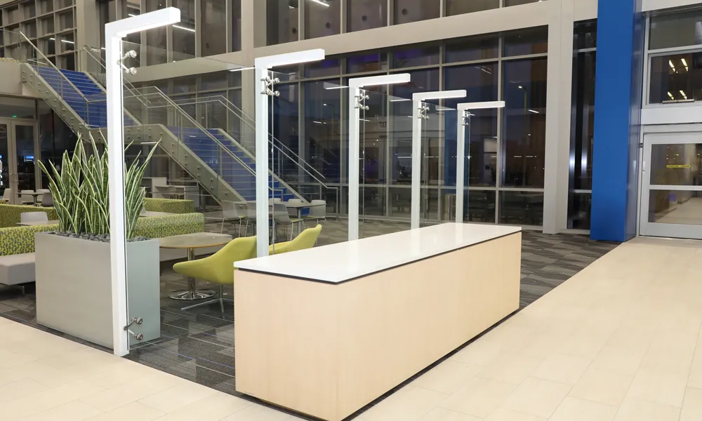 ​​A spacious, well-lit indoor lounge with flexible seating arrangements for meetings and social events.