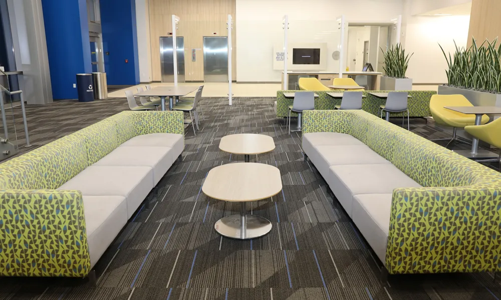 Close-up of a comfortable lounge sofa with modern coffee tables.