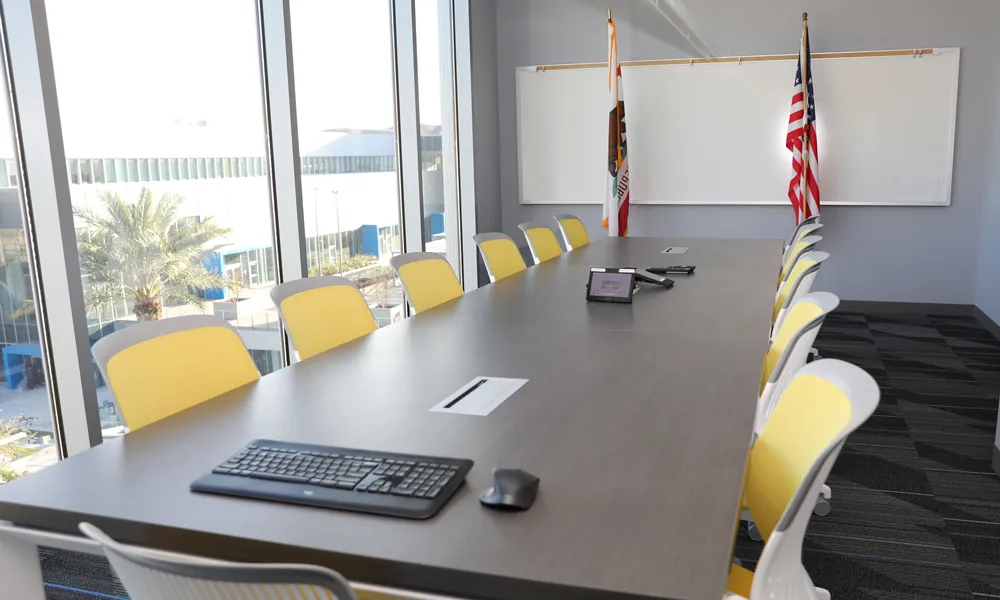 A corner view of a minimalist meeting space.