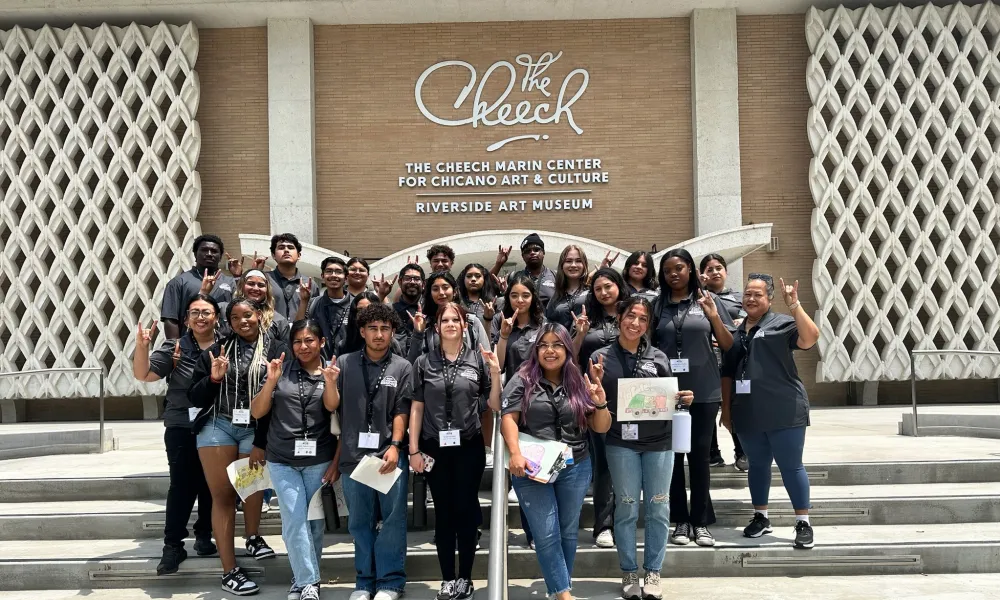 Group of students in from of the Cheech Museum steps