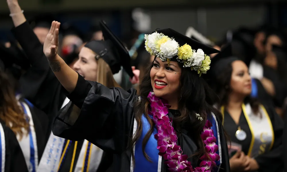 Woman in floral crown graduating