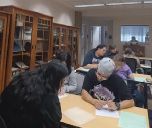 Students work in the archives at a desk
