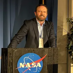 Jeffery Marino, a graduate of CSUSB, speaks at joint NASA/state event in 2023.