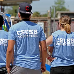 Students in T-shirts showing CSUSB Volunteer on their backs.