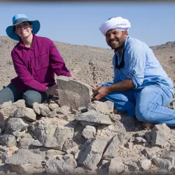 Two members of Wadi el-Hudi Expedition at archaeological excavation site in Egypt.