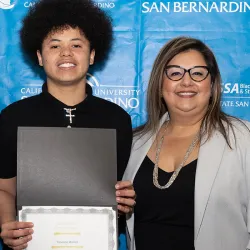 Keisha Rivers, left, associate director of Financial Aid and Scholarships, and Veronica Ramirez Amerson, right, director of the Educational Opportunity Program, announced the recipients of the student scholarships at this year’s Pioneer Breakfast.