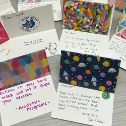 Attendees of the Human Resources Division Summer Social wrote personal notes of encouragement to students, a token of support as they begin the new academic year.