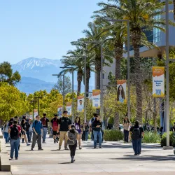 Students make their way on Coyote Walk at CSUSB.