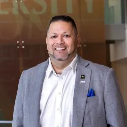 CSUSB alumnus RalphFigueroa, a rehabilitation counseling graduate, U.S. Army veteran and first-generation college graduate, on the Cal State San Bernardino campus.