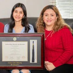 First-generation college graduate Jennifer Cornejo, center, with her parents is a proud Coyote!