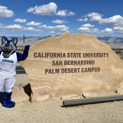 Cody the Coyote stands at the entrance of the CSUSB Palm Desert Campus.