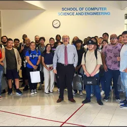 At the School of Computer Science and Engineering offices in the Jack H. Brown College building, Khalil Dajani, chair/director, at the center with students. The school had its ABET accreditation extended through 2032.