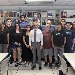 Nabeel Alzahrani, center, with his 2026 Summer AI Student Research Assistants at CSUSB’s AQFS Research and Training Lab.