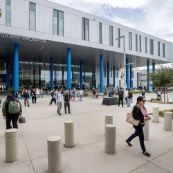Students walking near the Center for Global Innovation building along Coyote Walk.