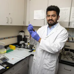 Graduate student Luis Gonzalez in a psychology lab at CSUSB