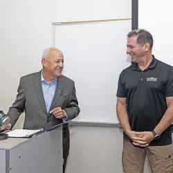 CSUSB President Tomás D. Morales (left) congratulates Vincent Nestler, professor in the School of Cyber and Decision Sciences and recipient of the 2026 Outstanding Professor Award.