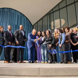 Students, faculty and administrators cut the symbolic ribbon marking the official opening of Cal State San Bernardino’s new Performing Arts Center.