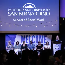 Speakers on the stage during New Student Orientation Dinner at the Santos Manuel Student Union North Conference Center.