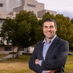 CSUSB graduate student and entrepreneur, Naja Faysal, in front of Jack H. Brown College of Business and Public Administration