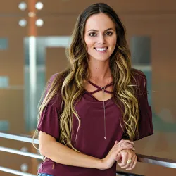 Amanda Bain standing in College of Education building