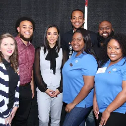 Angela Rye (center, wearing the black bow) with some of the staff from the CSUSB Office of Student Engagement