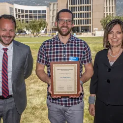 Ryan Keating, director of the Office of Student Research and professor of history; Jacob Jones, associate professor of psychology and one of the four awardees; and Dorota Huizinga, dean of Graduate Studies and the Office of Student Research