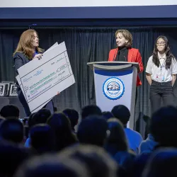Stage photo of a team being awarded at the 2023 Virtual Enterprise International – West Coast Regional Tradeshow, Competition and Exhibition.