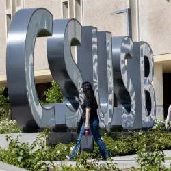 Students by the CSUSB spirit letters