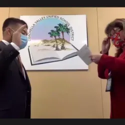 CSUSB alumnus Adonis Galarza-Toledo (left) is sworn in as a member of the board of the Coachella Valley Unified School District. 