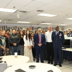 Beginning at center left, Jennifer Jin (in the white jacket), assistant professor, School of Computer Science and Engineering; Khalil Dajani, director and professor, School of Computer Science and Engineering; Stephan Ewart, U.S. Air Force Head of Engineering Squadron; Air Force Col. Ahave Brown Jr., commander of 412 MXG Squadron; with students who attended an Oct. 26 event at CSUSB.