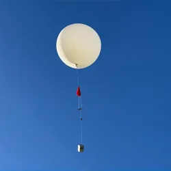 An ozonesonde balloon rises into the sky above Cal State San Bernardino, part of the NASA/NOAA Aeromma airborne campaign to study pollution dynamics.