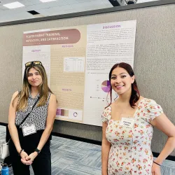 Denise Moreno Romo (left) and Dulcinea Catota were among the students who presented their research at annual MSW Research Symposium.