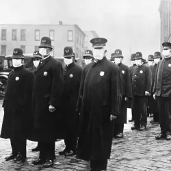 Policemen in Seattle wearing masks made by the Red Cross, during the influenza epidemic of 1918, in December 1918.