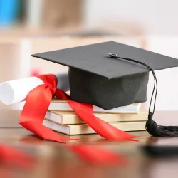 Mortarboard and illustration of a diploma