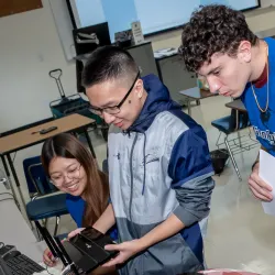 Students and camp instructors look over equipment at the recent GenCyber Summer Day Camp at CSUSB.